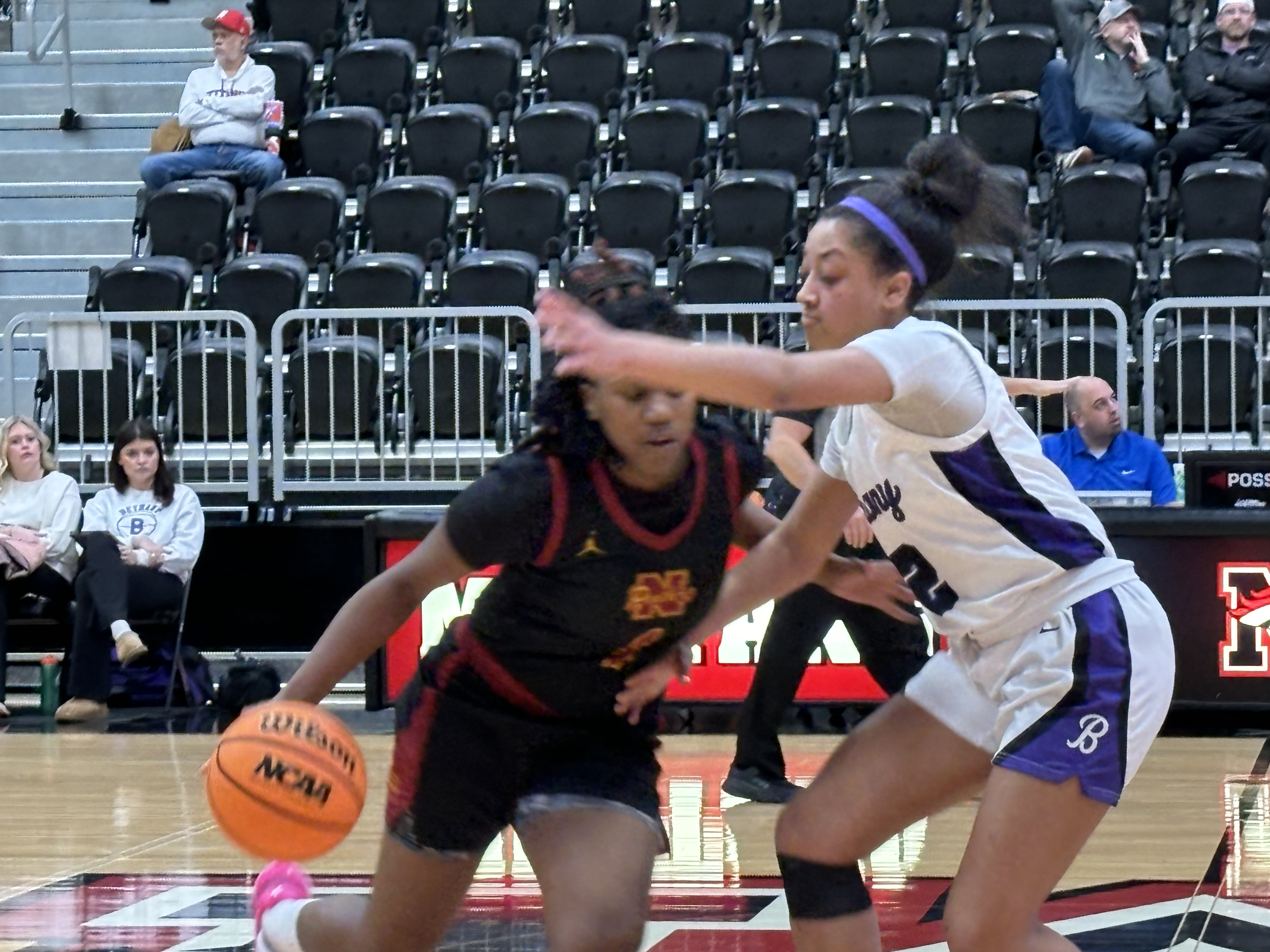 Zya Vann guards a Putnam City North's Nini Geretta Thursday (Dec. 28) in the Lady Bronchos' win during the Bank 7 Mustang Holiday Classic