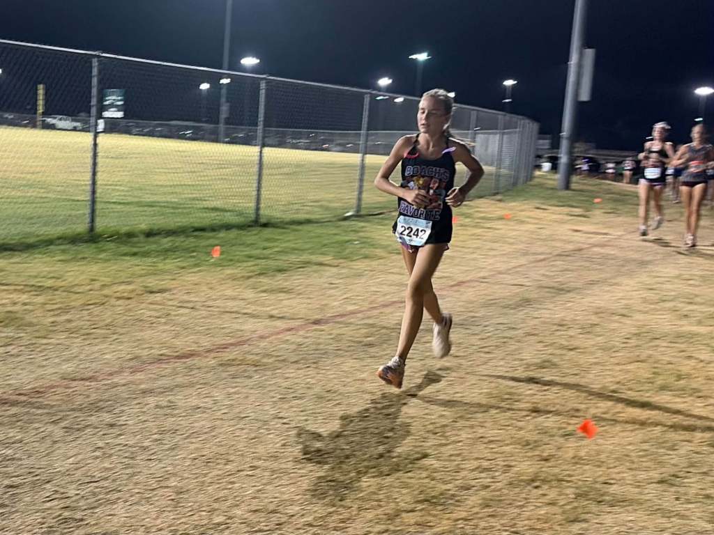 Bronchos run under the lights at Mustang